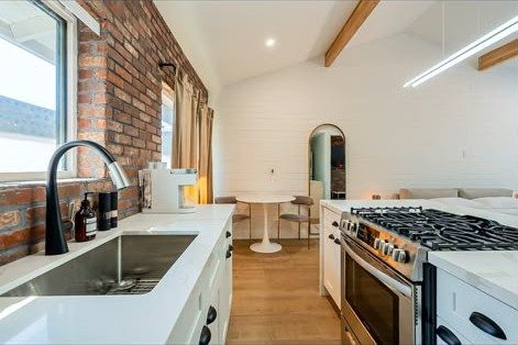 Suite kitchen with exposed brick at Second Sunrise Recovery
